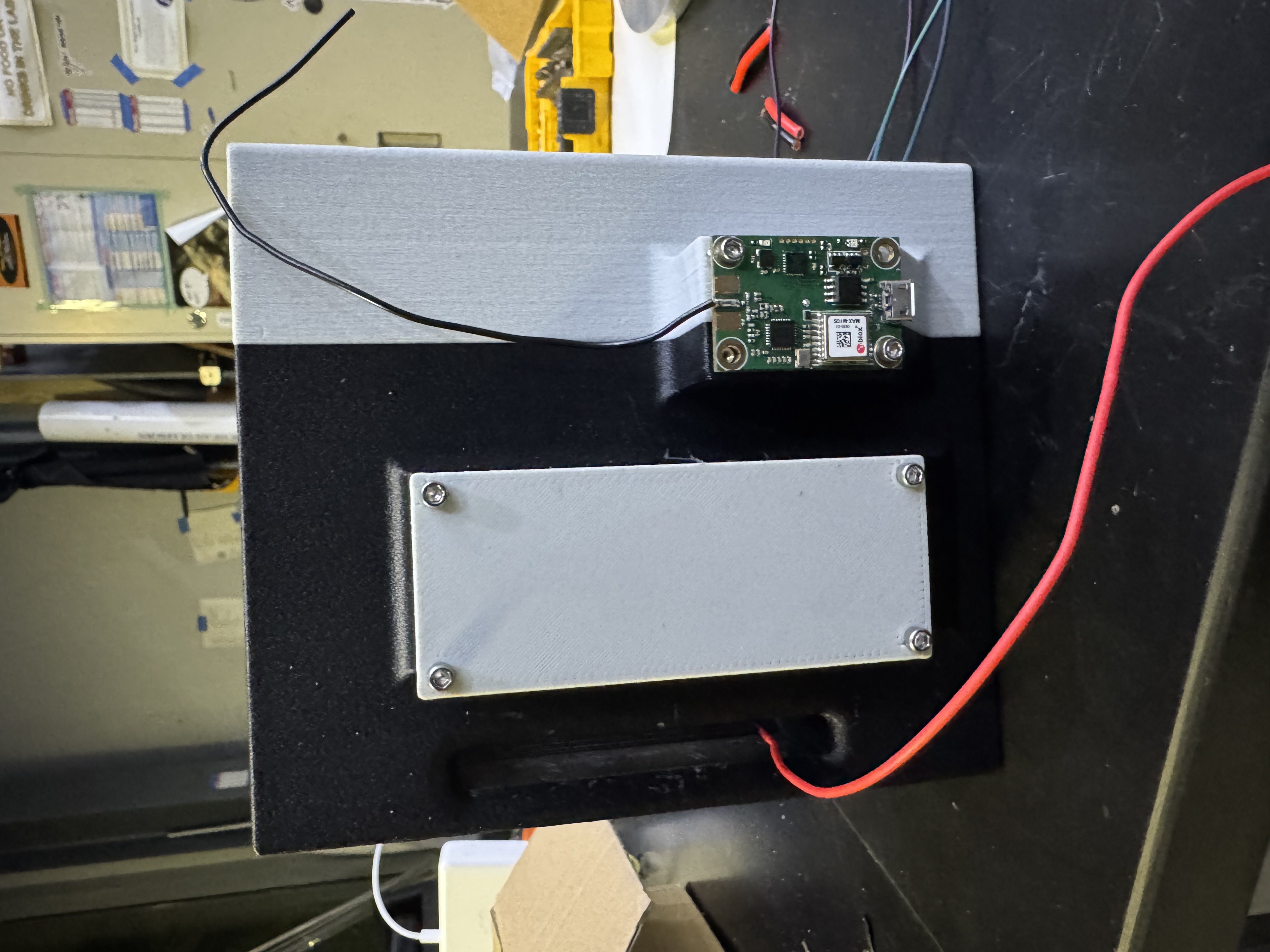 Photo of the assembled avionics bay GPS face with the TeleMetrum GPS board mounted beside the battery cover