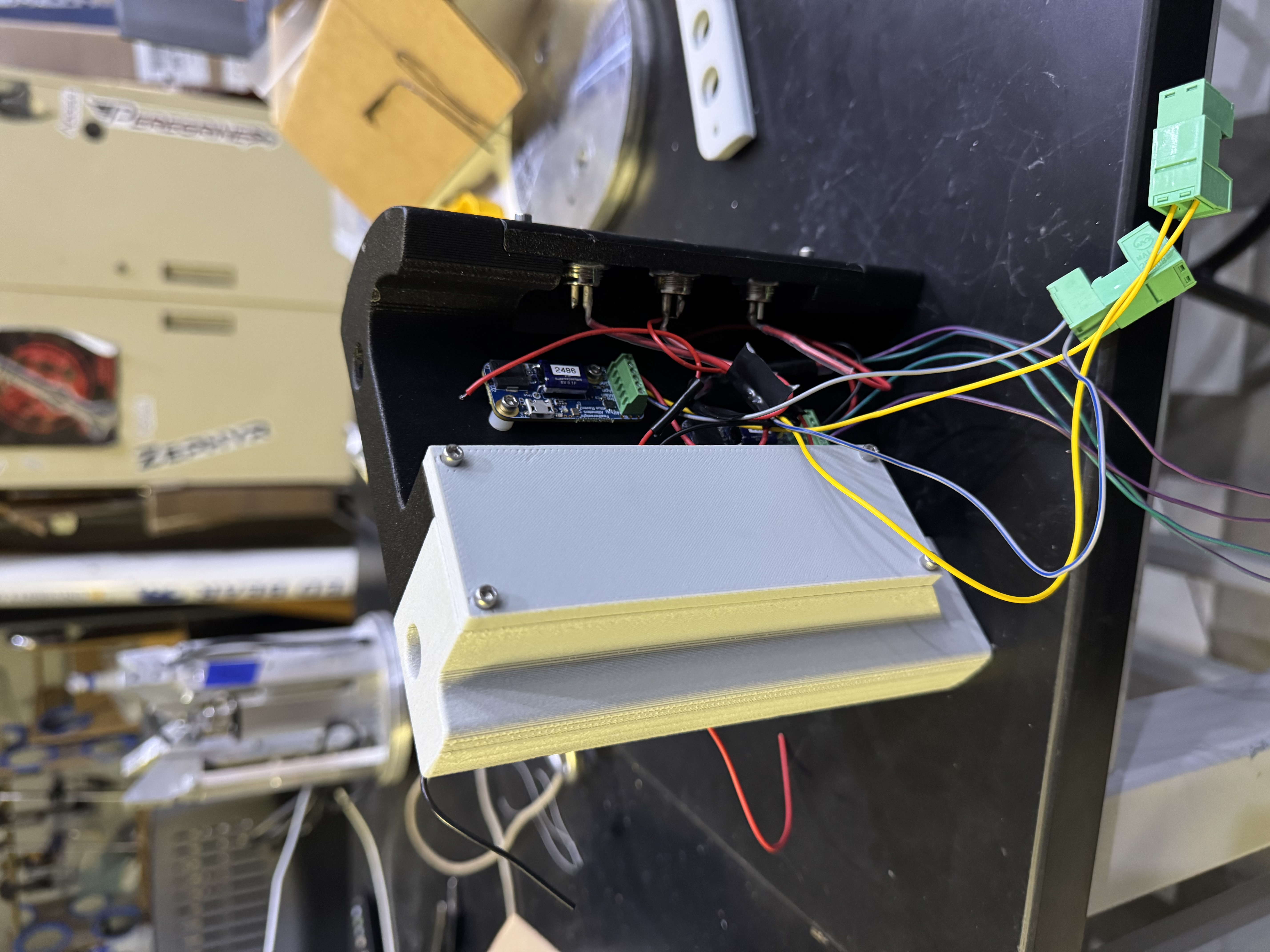 Photo of the 3D-printed avionics bay during wiring, with altimeter boards and key switches installed